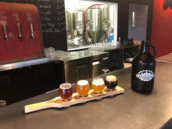 Wooden board used as a base for four different beers.