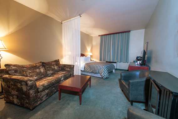 Salon dans une chambre à l'Auberge Val Saint-Côme