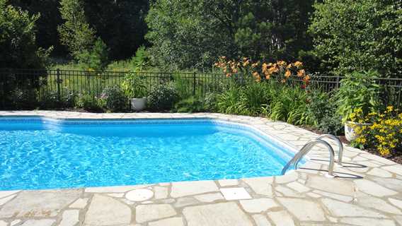 Outdoor pool at Auberge Le Cheval Bleu