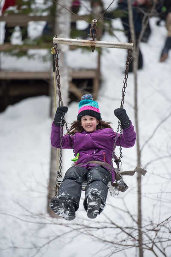 A little girl doing a swing at Havre Familial