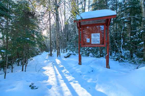 Entrance to snowshoeing trails at Auberge du Lac Priscault