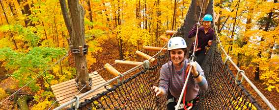 Two girls in tree walks in Arbraska in fall