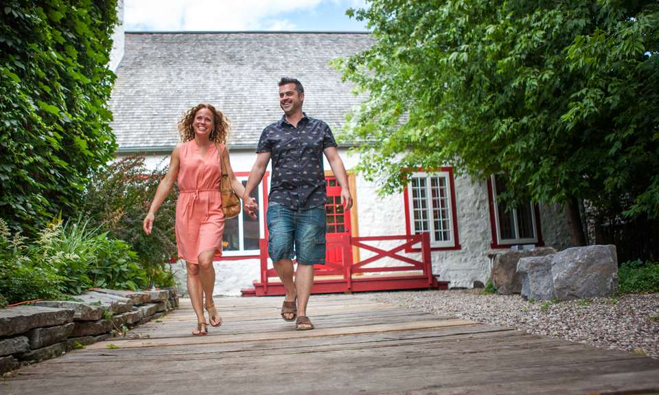 Happy couple walking at Île-des-Moulins