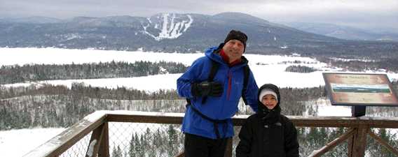 Snowshoeing with the family on the trail Mont Sourire