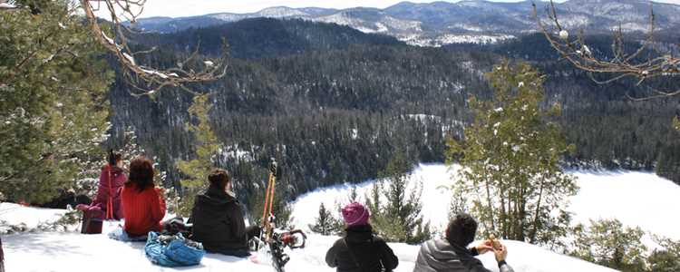 Friends snowshoeing together to the top of Lac Blanc