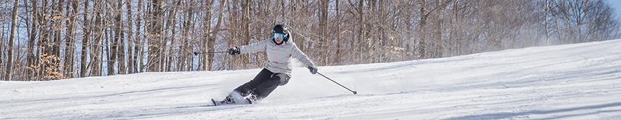 Man downhill skiing at Ski Montcalm