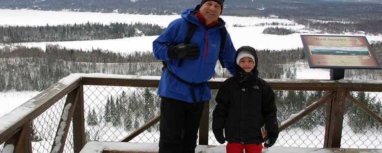 Snowshoeing with the family on the trail Mont Sourire