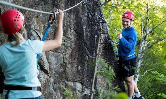 Two people on a rock wall in Arbraska